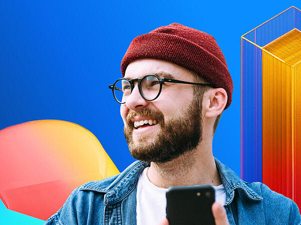 Man holding a smartphone in front of abstract data visualizations – cover image of the B2B Content Marketing Trend Study 2026