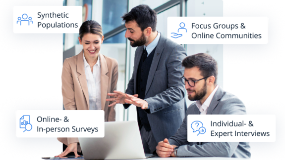 eam collaborating around a laptop, illustrating four research methods: synthetic populations, surveys, focus groups, and expert interviews